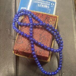 7mm genuine lapis beads with original box
About 24 inches